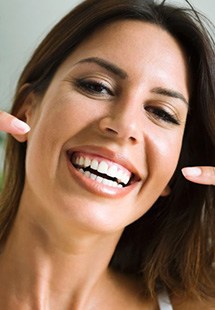 Woman pointing to her teeth